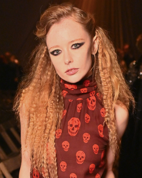 Closeup shot of a model with copper rose hair
